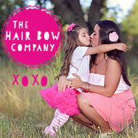 Mom and daughter hugging each other wearing The Hair Bow Company's bow. 30 days of giveaway series