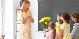 children give teacher flowers