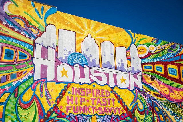 A mural with the text Houston inspired, hip, tasty, funky, savvy. 