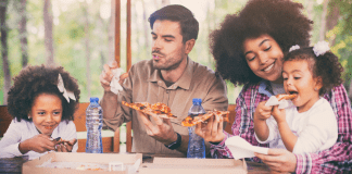 Houston’s Best Pizza Restaurants A family of four eating pizza.