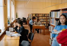 people reading and working on computers at the library