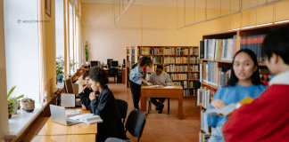5 Secret Library Hacks {+ Bonus Digital Resources & Services Too!} people reading and working on computers at the library