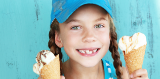 Houston’s Top 10 Ice Cream Shops young girl holds two ice cream cones