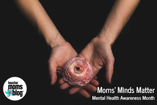Moms' Minds Matter. Mental health Awareness Month. Houston Moms blog. A photograph of hands holding a flower.