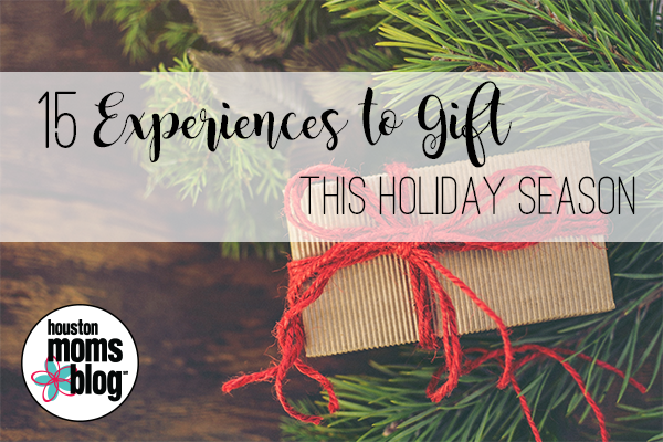 15 Experiences to gift this holiday season. A photograph of a wrapped present on a pine bough. Logo: Houston moms blog.