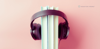 Why Audiobooks Should Be On Your Family’s Summer Reading List Headphones around stack of books