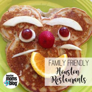 Family Friendly Houston Restaurants. Logo: Houston moms blog. A photograph of a pancake with facial features created from fruit. 