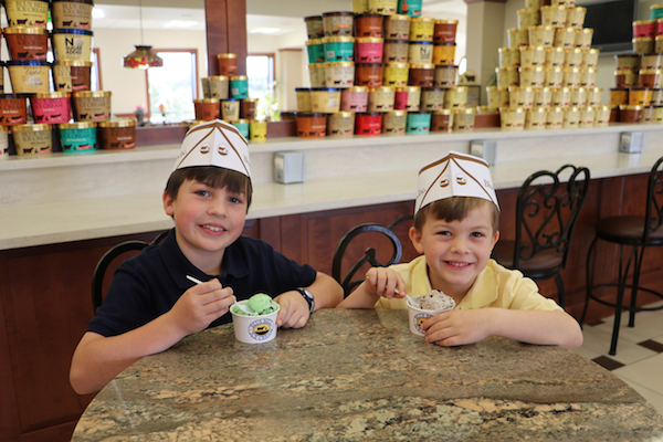 Two Kids eating ice cream at Blue Bell Creamery. 