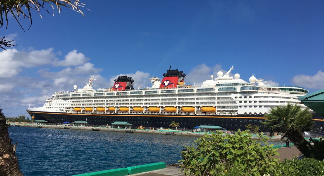 A photograph of a docked Disney Cruise ship.