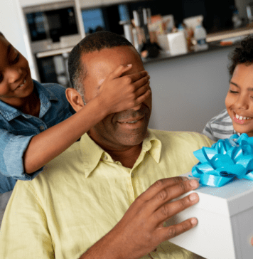 A Father’s Day Gift Guide for Houston Dads children surprising dad with father's day gift