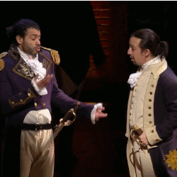 A GIF of two actors from Hamilton giving each other a high five. 