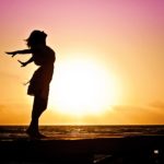 beach-woman-sunrise-silhouette-40192