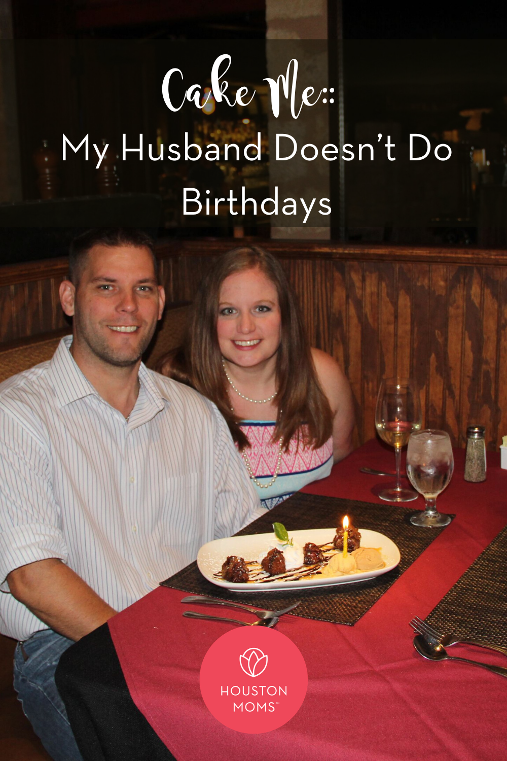 Cake Me: My husband doesn't do birthdays. Logo: Houston Moms. A photograph of a husband and wife sitting at a restaurant with a dessert with a lit candle in front of him.  