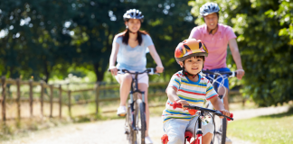 Spring Break Staycation Ideas for Houston Families A family of three riding bikes.