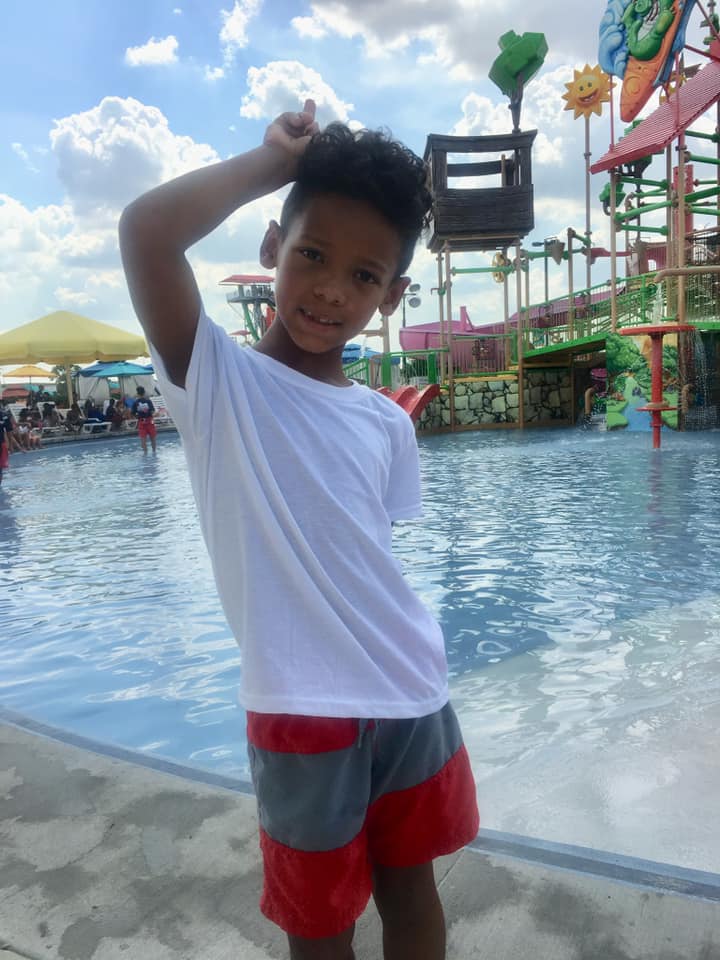A young boy in front of a pool at Typhoon Texas. 