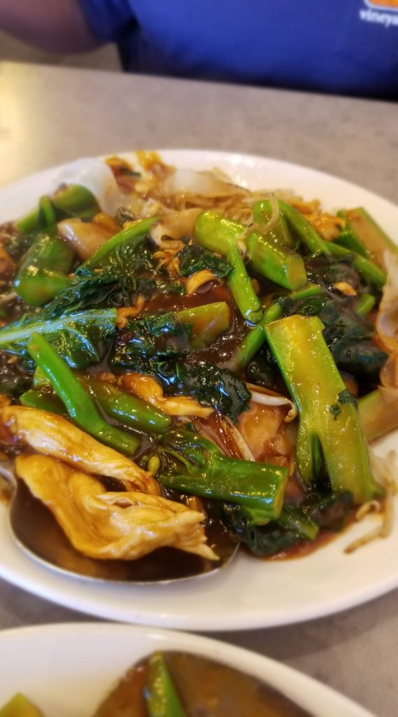 An Asian dish with vegetables and chicken. 