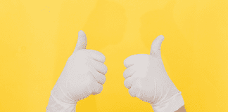 A COVID Contingency Plan: A Mom’s To-Do List When the Virus Hits Gloved hands both giving a thumbs up.