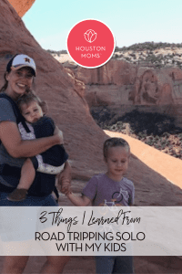 3 things I learned from road tripping solo with my kids. A photograph of a mother holding a young girl and standing next to a young boy at a national park. Logo: Houston moms. 