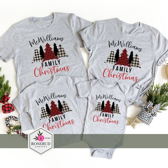Three grey t shirts and a onesie matching with Christmas trees and family names