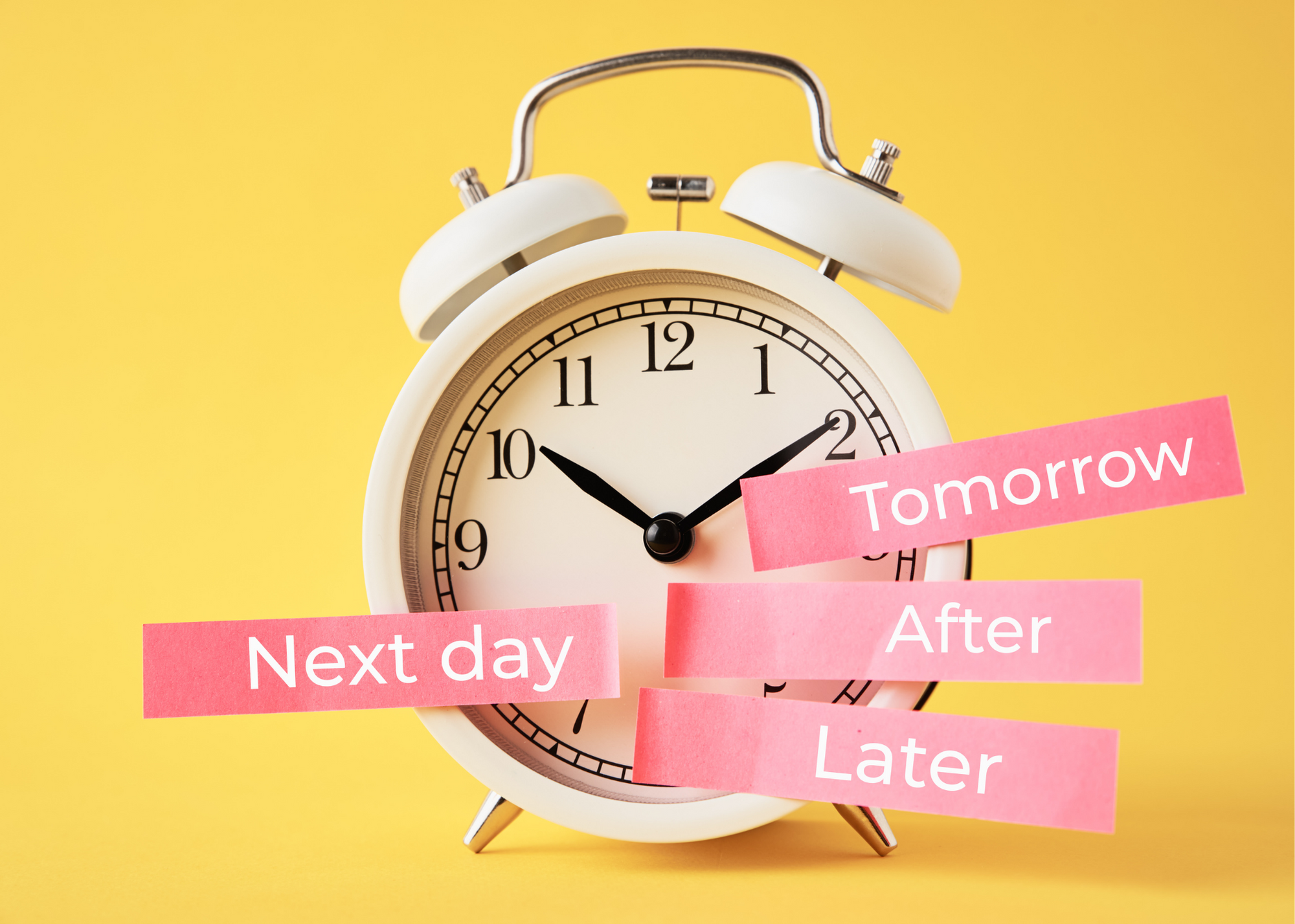 alarm clock with sticky notes attached that say "Next day", "Tomorrow", "After", and "Later"
