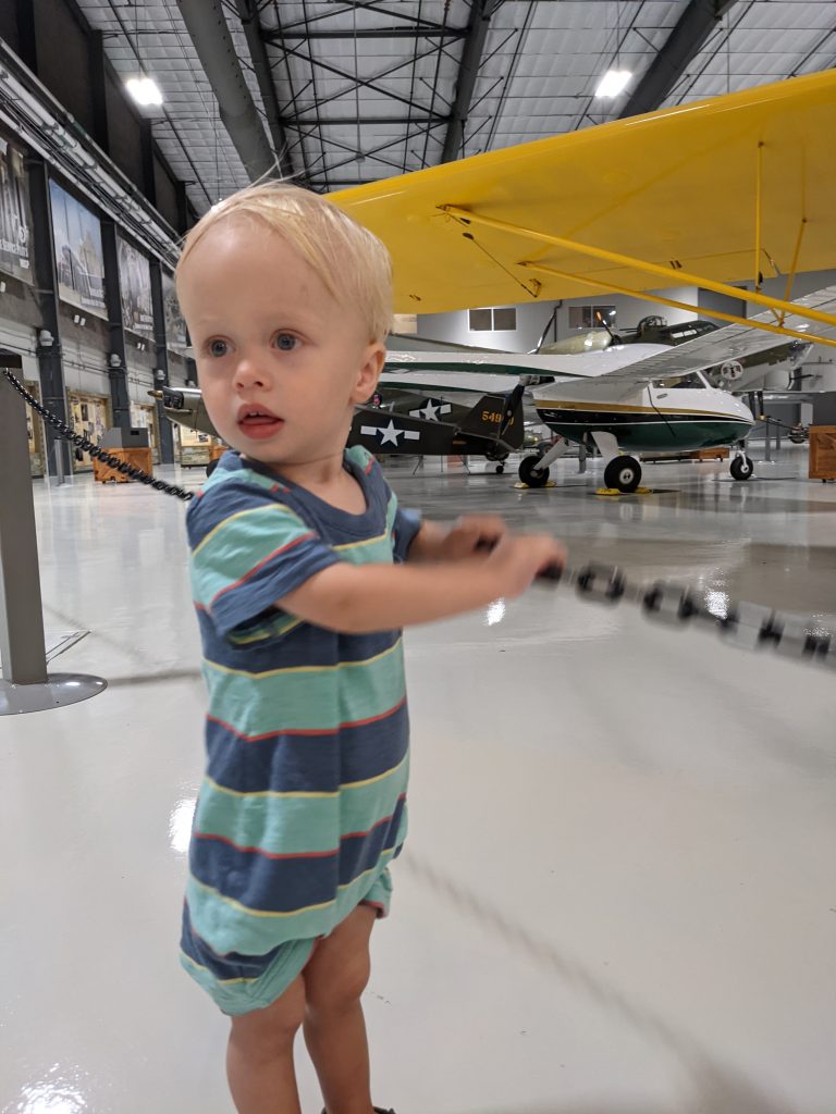 toddler looks at planes at Lonestar Flight Museum