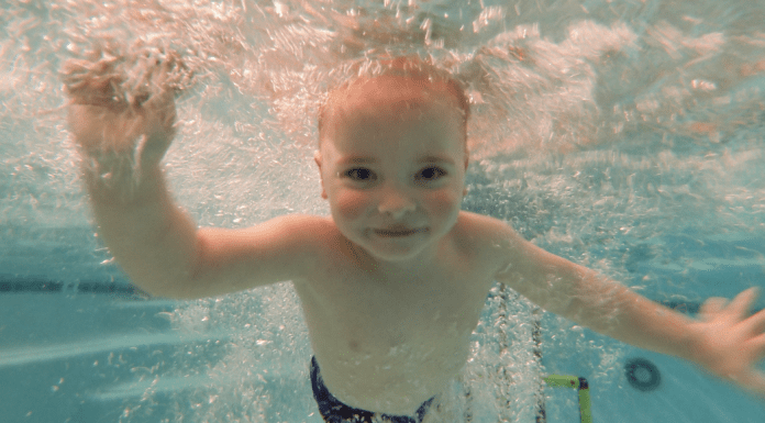 Why You Should Enroll Your Child In Swim Lessons Today boy underwater