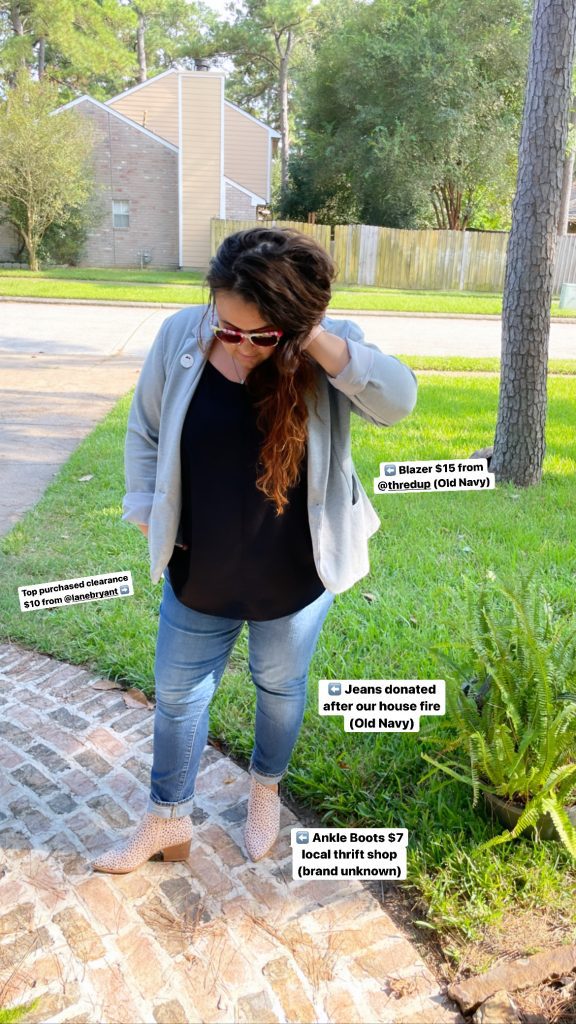 woman standing in thrifted outfit with labels where each item came from