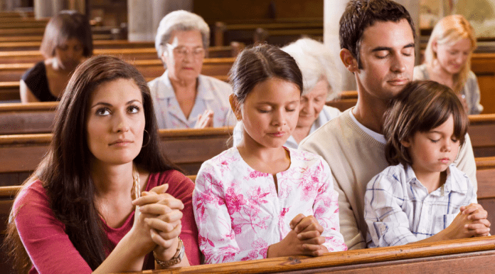 woman in church pew with family