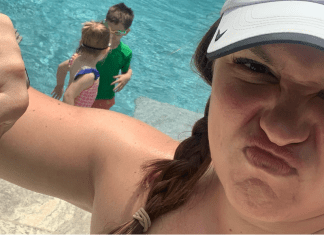 woman gives thumbs down at pool