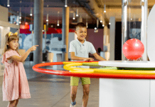 children playing with a display at a museum