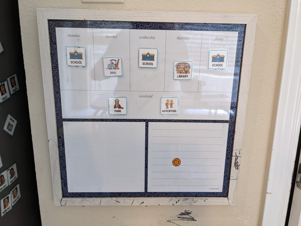 calendar with days of the week and magnets with activities