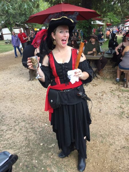 woman at Texas Reniassance Festival holding a drink 