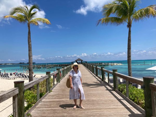 woman on pier at tropical location