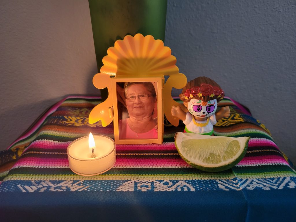 picture of lost loved one, candle, and lime