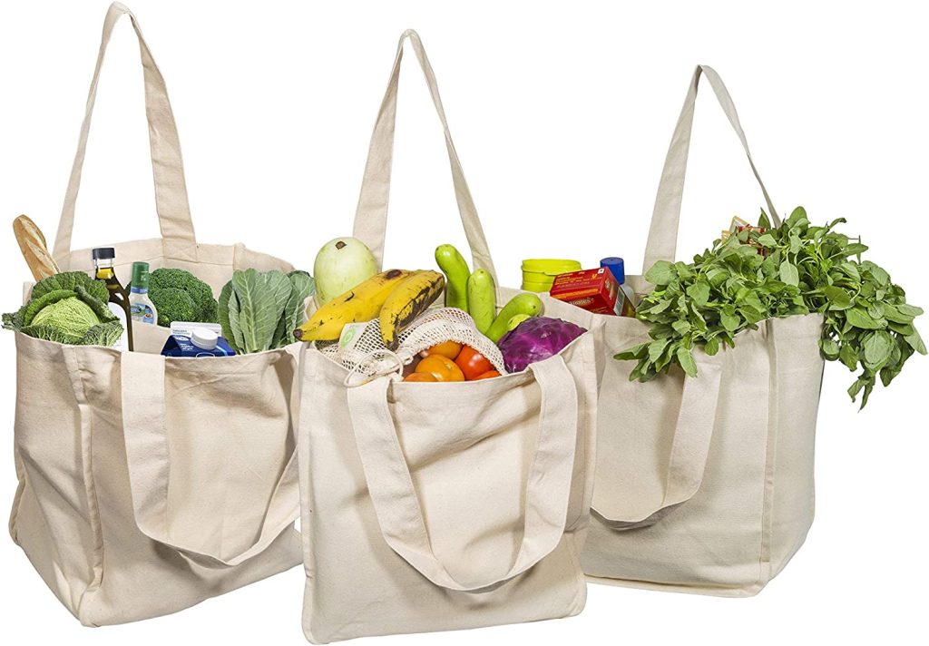 reusable grocery bags filled with produce