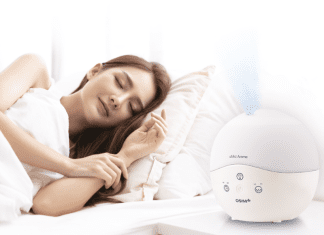 Reducing Stress, Right From Home woman sleeps next to aroma therapy device from OSIM