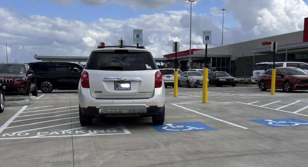 car illegally parked in an accessible parking spot