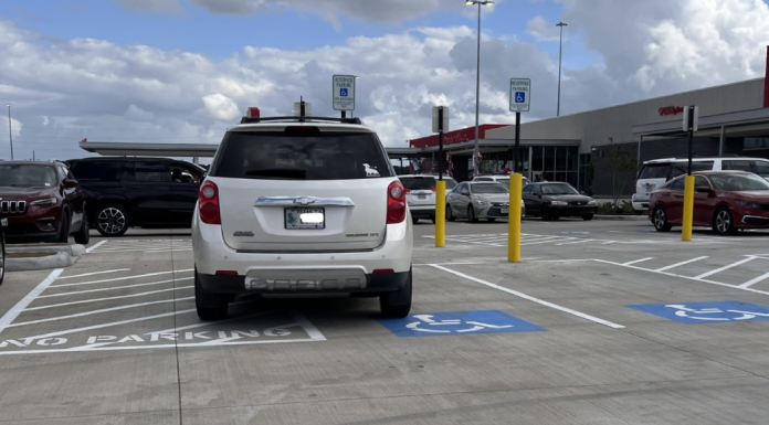 car illegally parked in an accessible parking spot