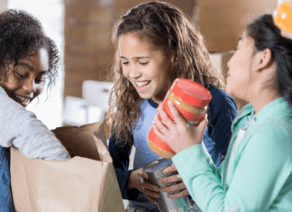 kids packing food in sacks