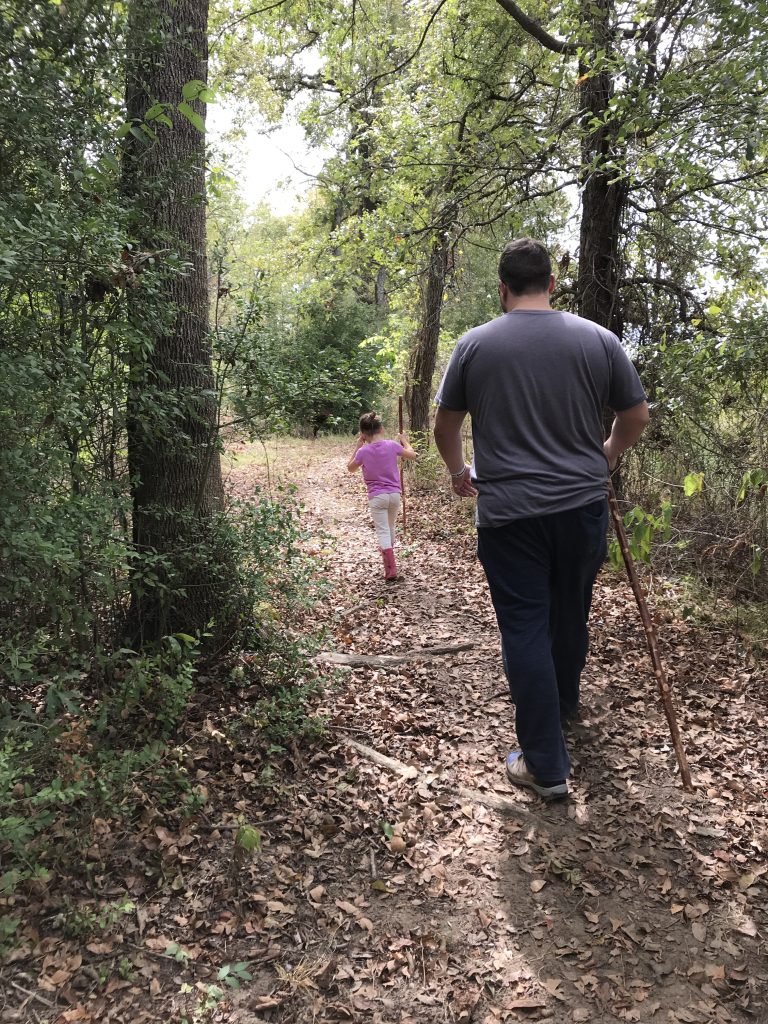 man and daughter hike at Fairfield Lake State Park 