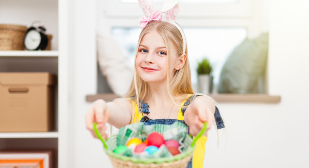 teen with bunny ears holding easter basket filled with eggs