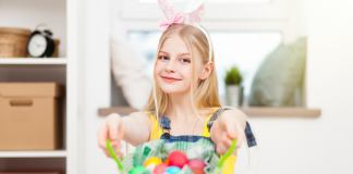 Easter Basket Ideas for Teens teen with bunny ears holding easter basket filled with eggs