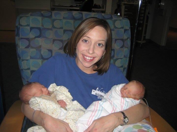 Mom holding her twin newborns for the first time