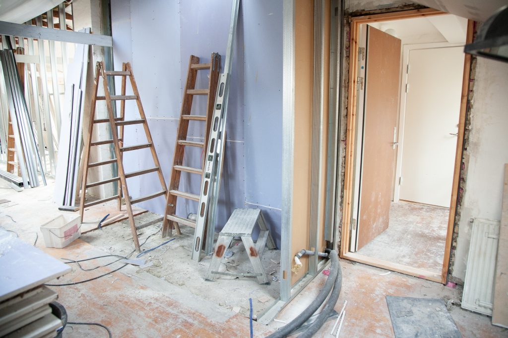 room with ladders and home improvement equipment