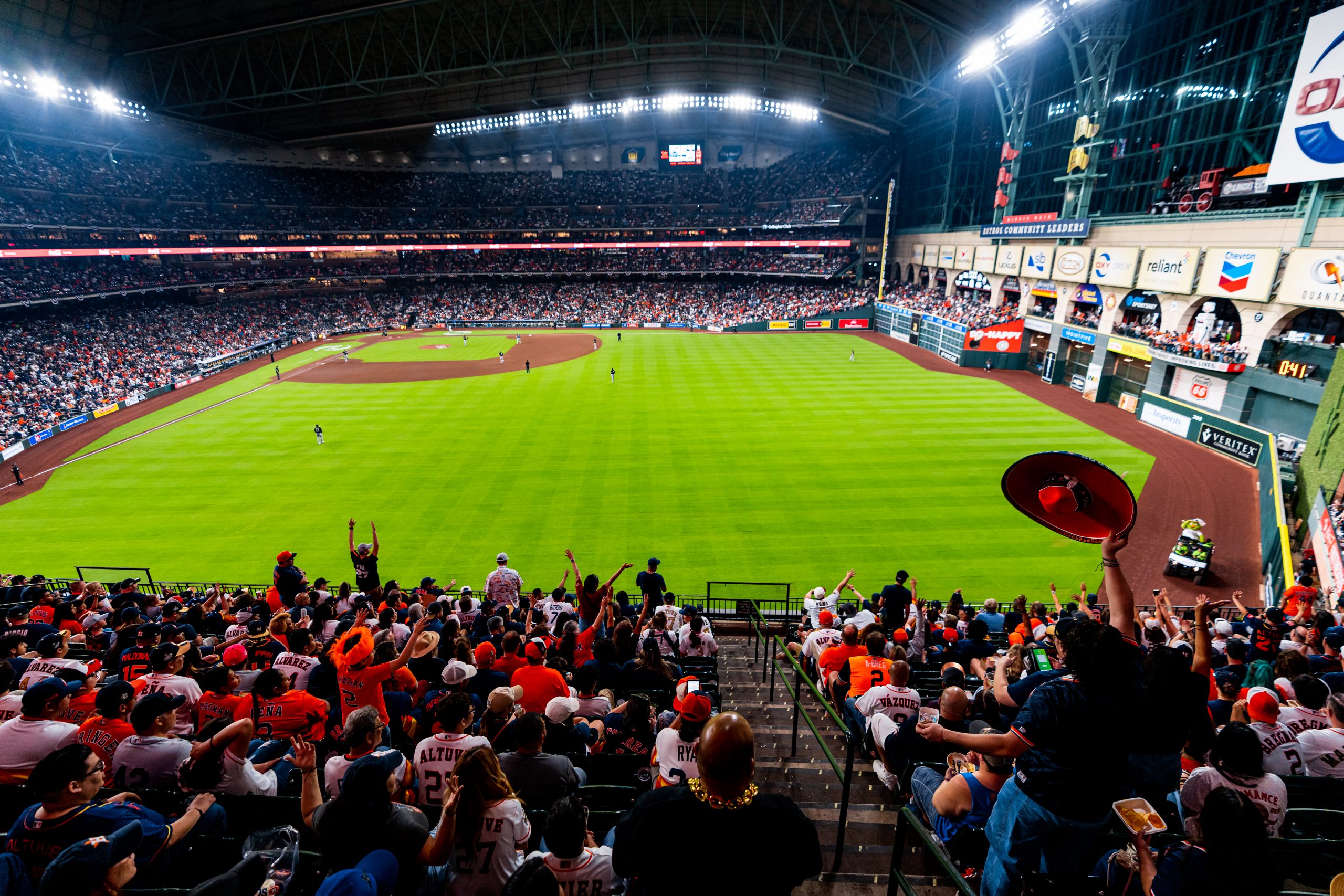 Crowd has family friendly fun at an Astros game, showing a view from the seats of Minute Maid Park