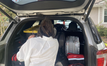 woman packing car for road trip