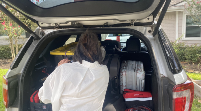 woman packing car for road trip
