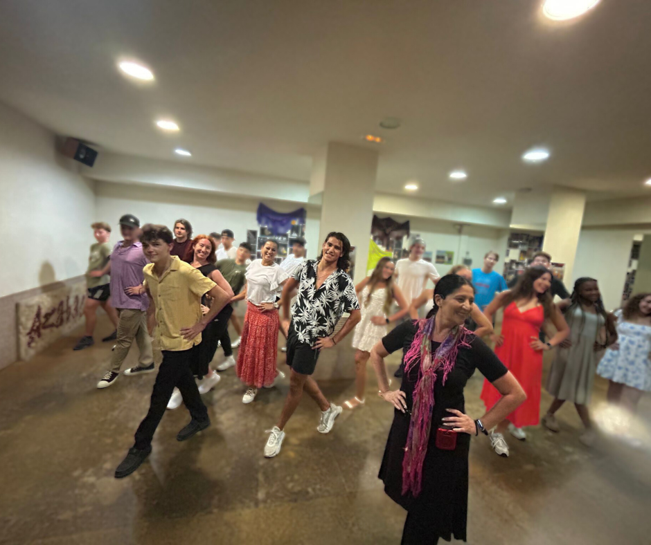group of young adults take flamenco dance class in Spain
