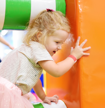 child on indoor play structure