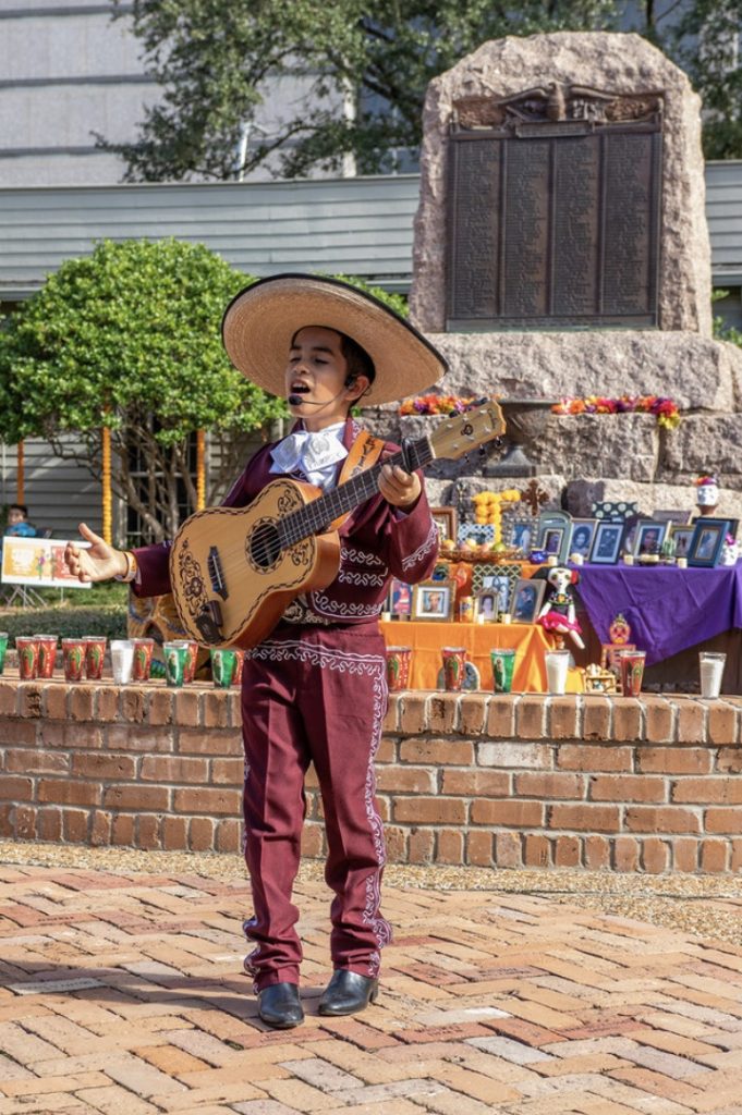 man in sombrero plays guitar